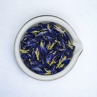Whole dried blue butterfly pea flowers for herbal tea and color-changing drinks.